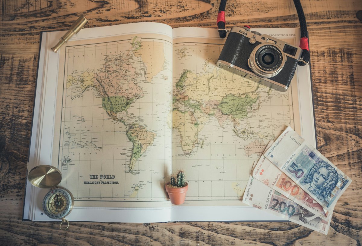City Breaks Explorer - Top 10 Places in the World to Travel - Map Camera Compass Banknotes
